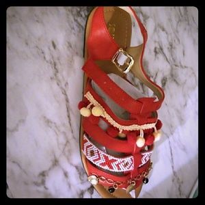Red strappy pompom sandals